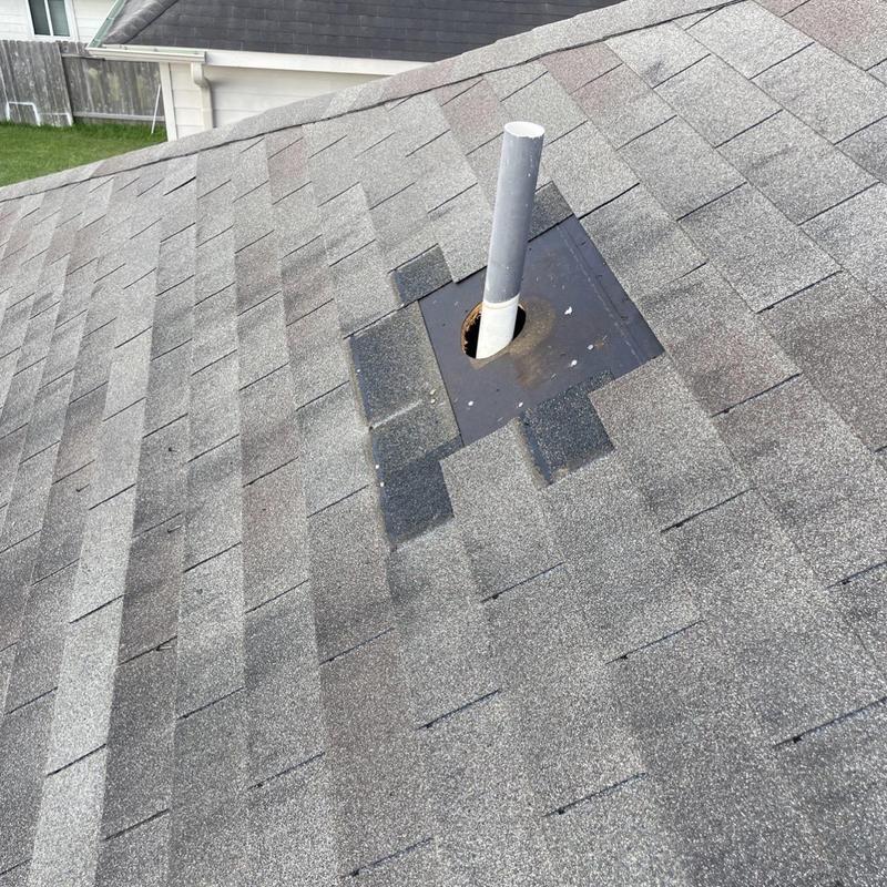 Roof flashing and vent pipe with replaced shingles