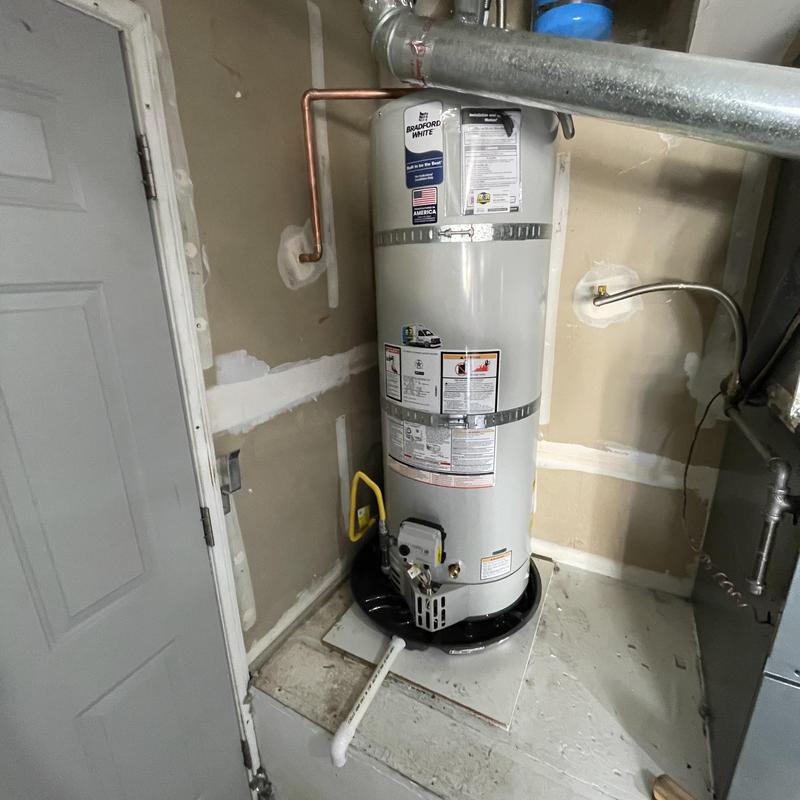 Bradford White natural gas water heater with drain pan