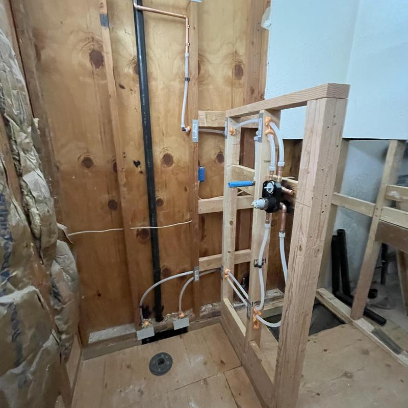 Multi-function shower valve rough-in with PEX lines
