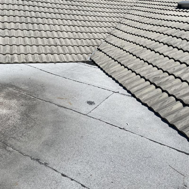 Flat roof membrane with tile roof seam in Hudson FL