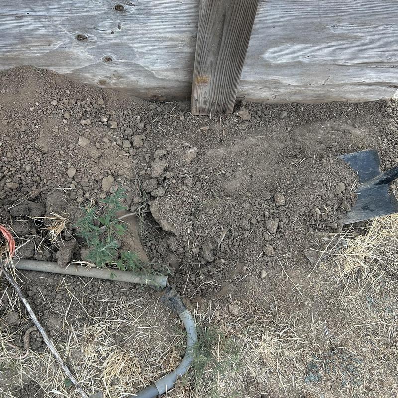Underground electrical splice kit installed by barn wall Underground electrical splice kit installed by barn wall