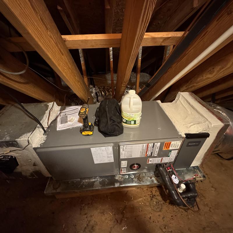 Heat pump air handler with tools in attic space