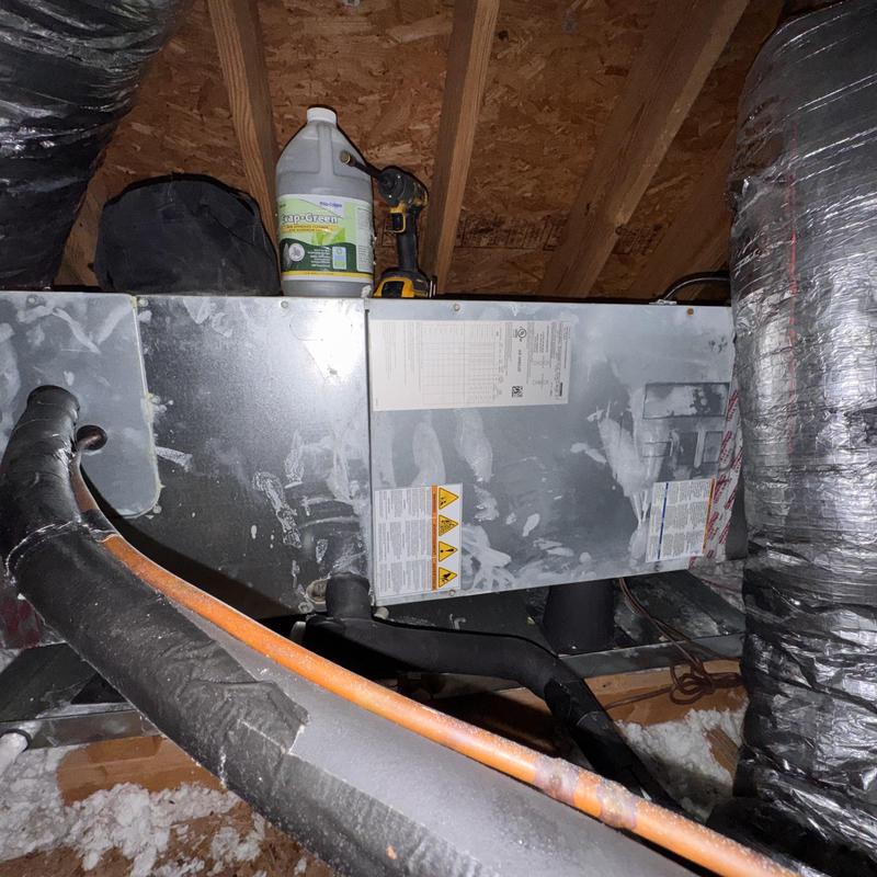 Heat pump air handler unit with ductwork in attic