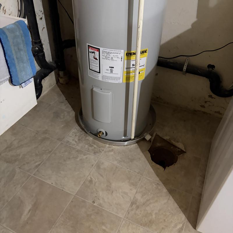 Water heater with basement floor drain installation area Water heater with basement floor drain installation area