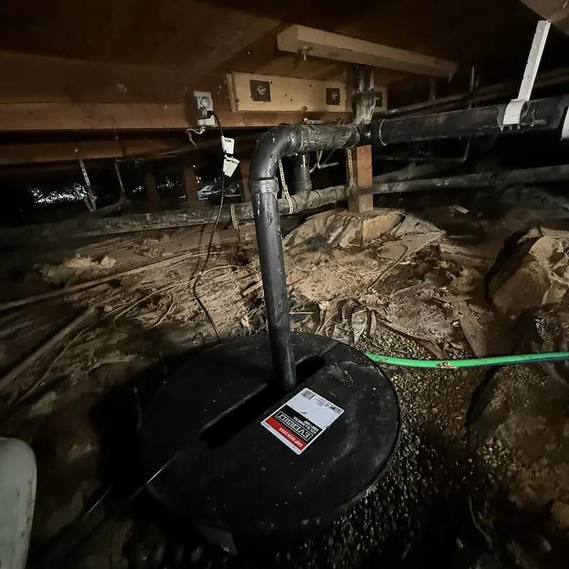 Sump pump and discharge piping installation in crawlspace