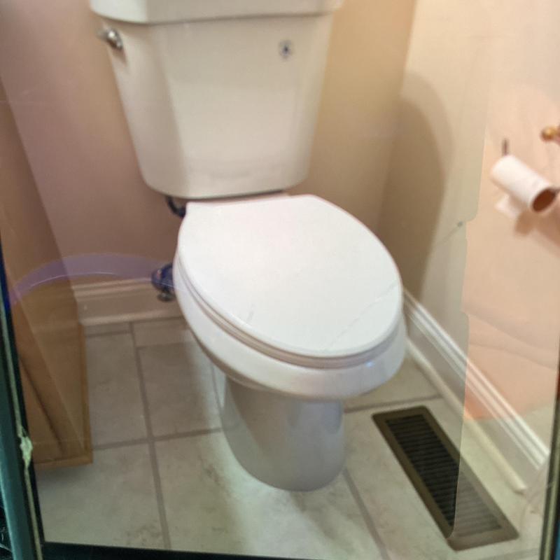 Ada elongated Glacier Bay toilet with new seal and shims
