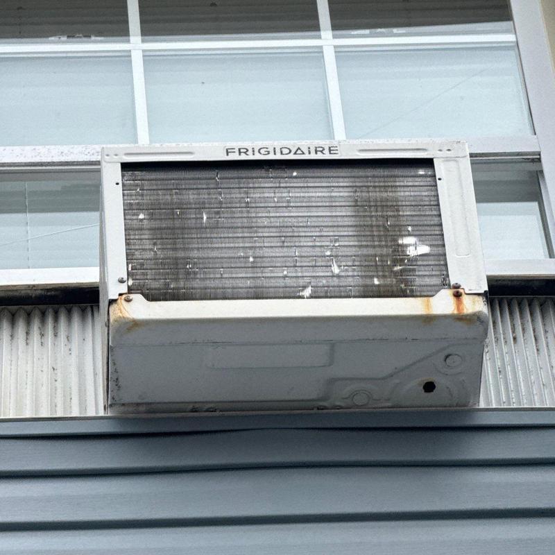 Window air conditioner unit with rust and damage