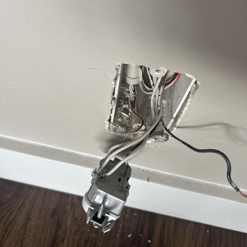 Backstab outlet with exposed wiring and wall box Backstab outlet with exposed wiring and wall box