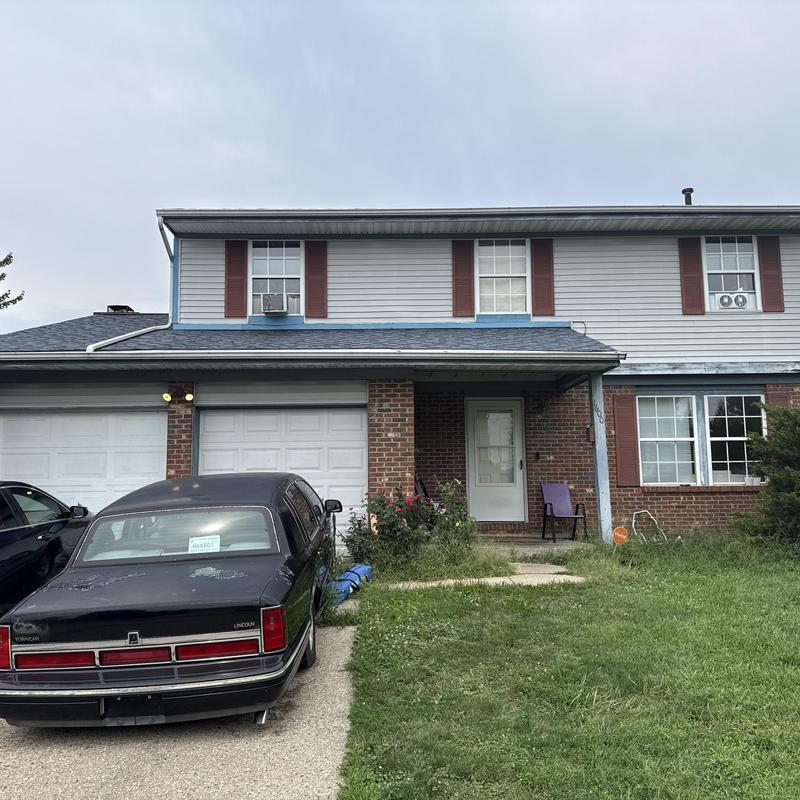 Vinyl siding and gutter inspection on two-story house Vinyl siding and gutter inspection on two-story house