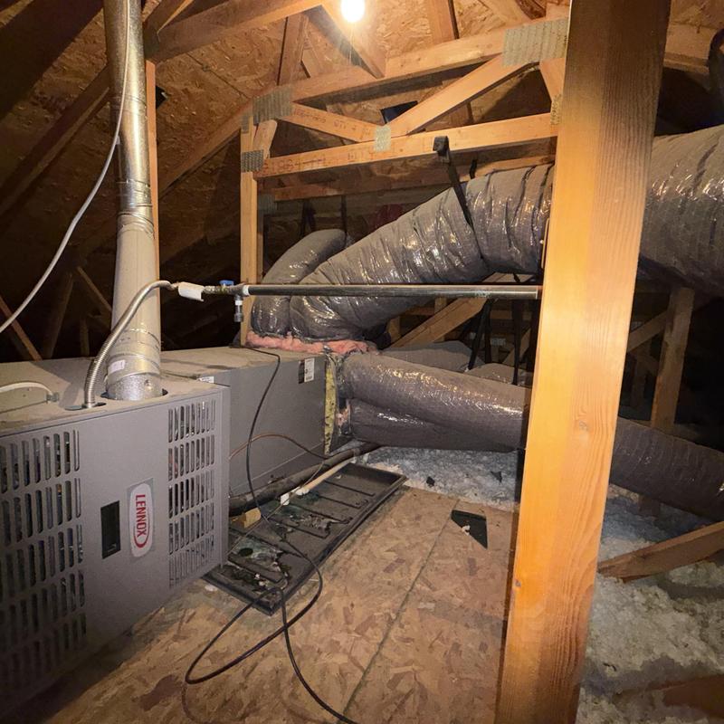 Furnace unit with vent ducts in attic installation Furnace unit with vent ducts in attic installation