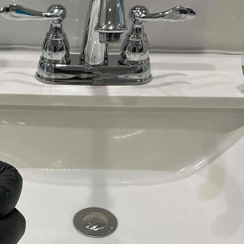 Pop-up drain assembly installed in bathroom sink