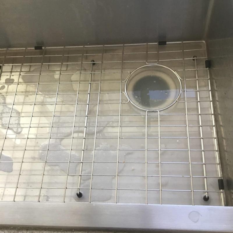 Kitchen sink drain with grease and food debris buildup