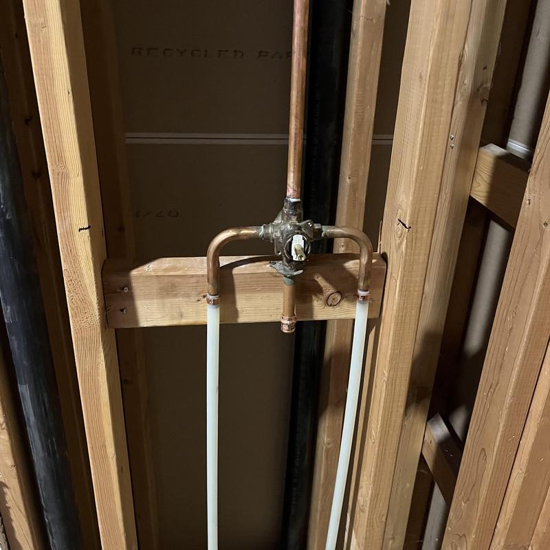 Shower valve and riser piping installation in wall frame