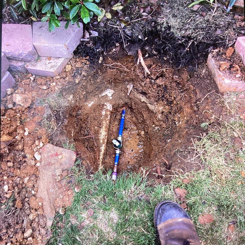Pressure reducing valve with water line access hole