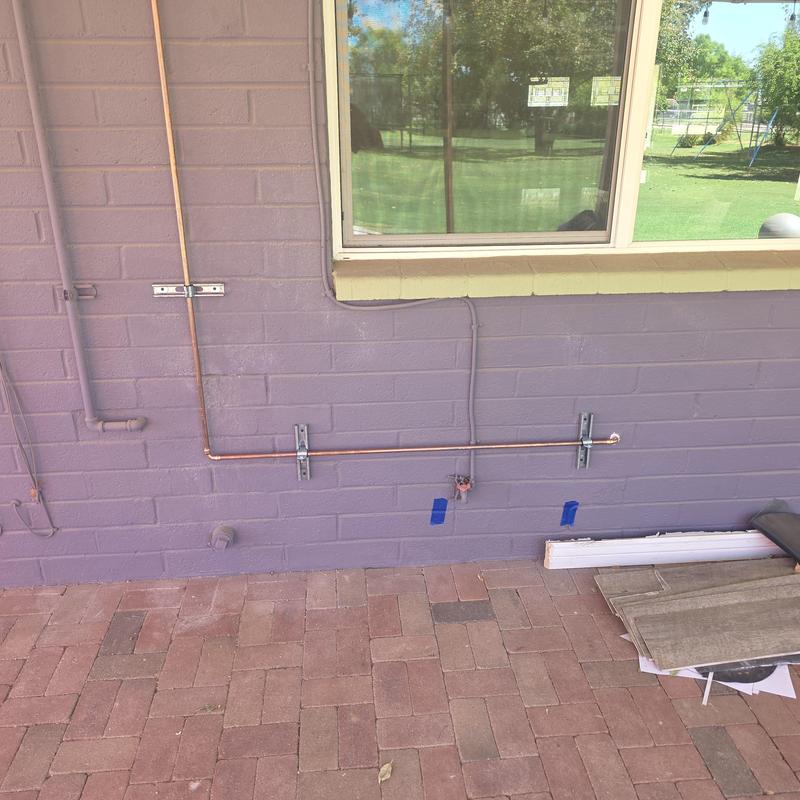 Copper hot water pipe rerouted on exterior wall Copper hot water pipe rerouted on exterior wall