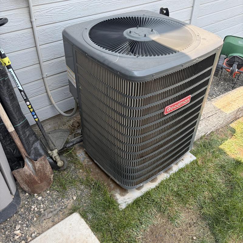 Goodman outdoor AC unit on concrete slab Goodman outdoor AC unit on concrete slab