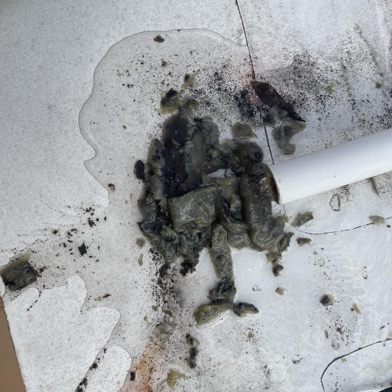 RTU clogged drain line debris and water spill on roof