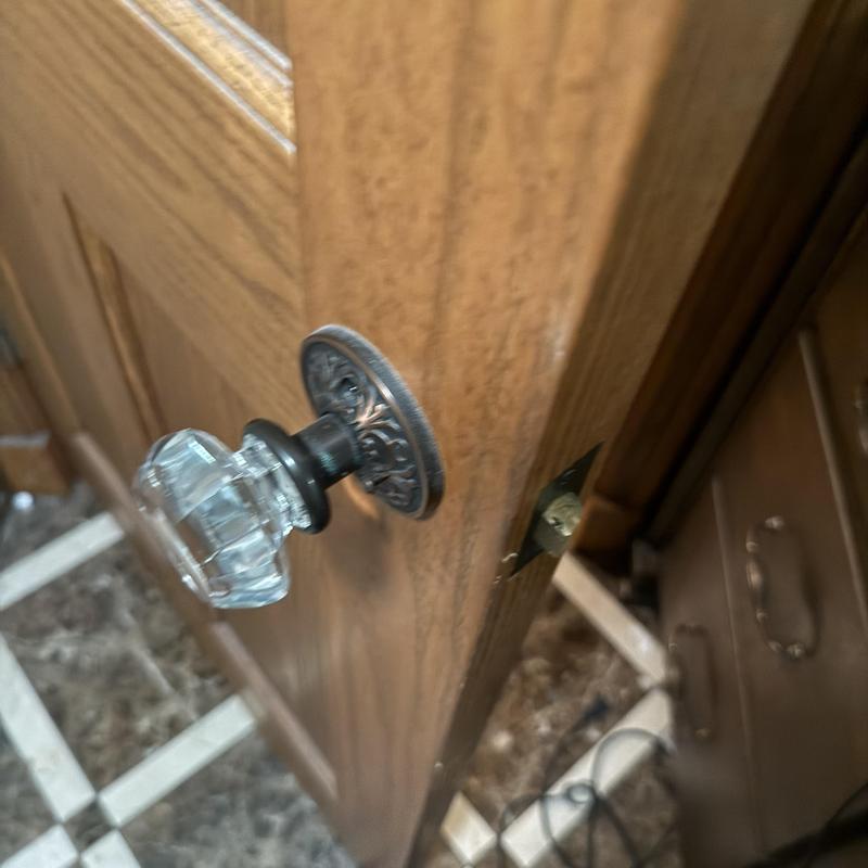 Glass doorknob lock on wood bathroom door jamb Glass doorknob lock on wood bathroom door jamb