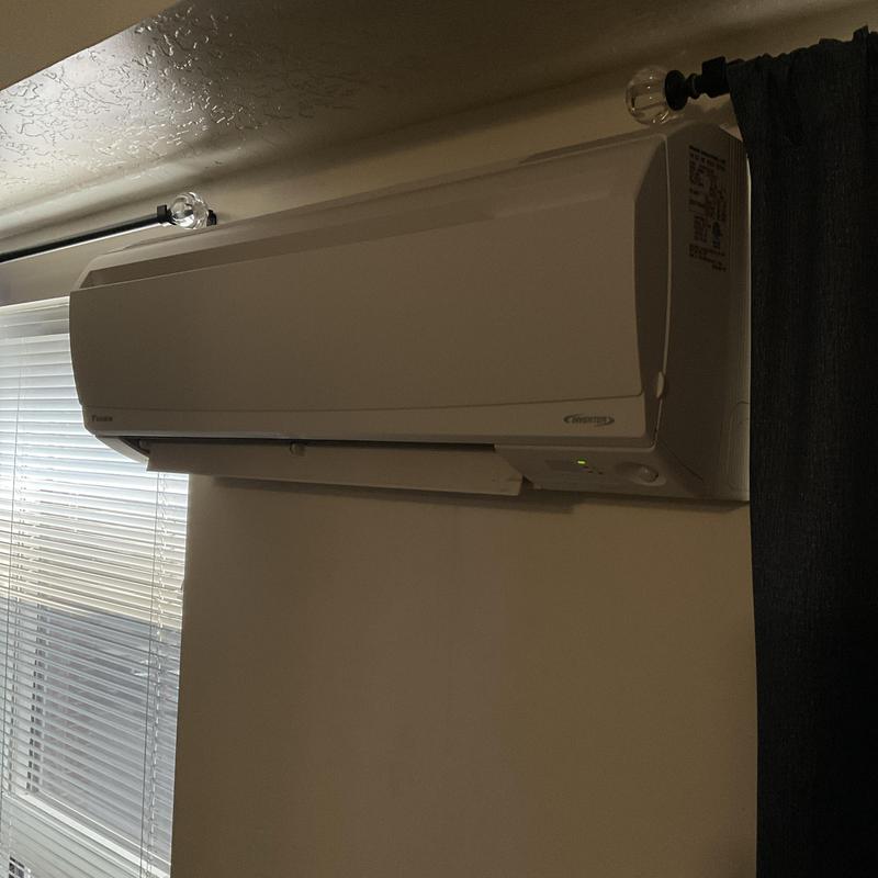 Mini split air conditioner unit mounted on wall Mini split air conditioner unit mounted on wall