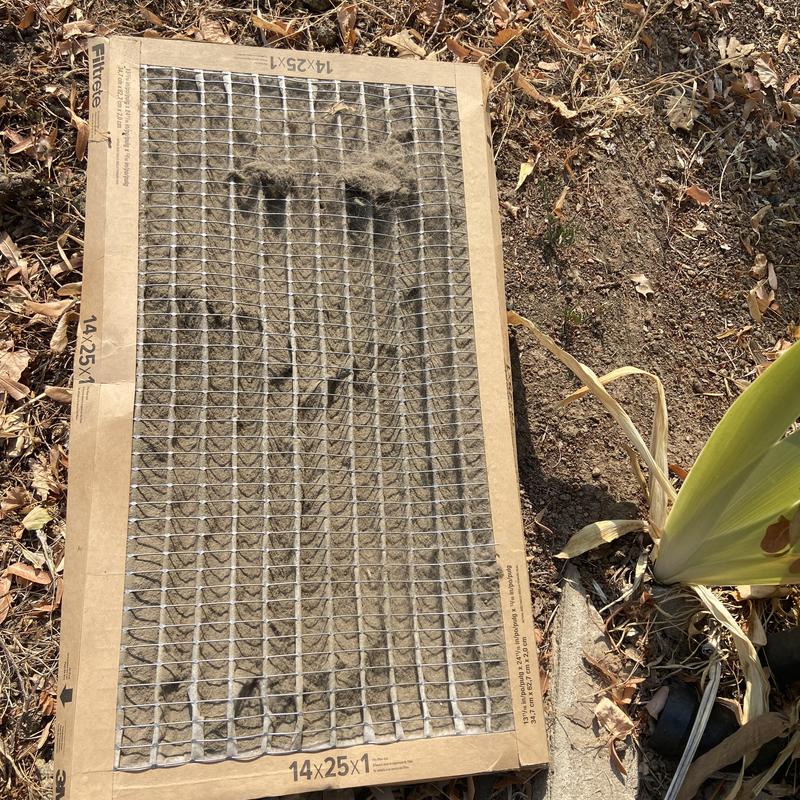 Air conditioner filter clogged with dirt and debris Air conditioner filter clogged with dirt and debris