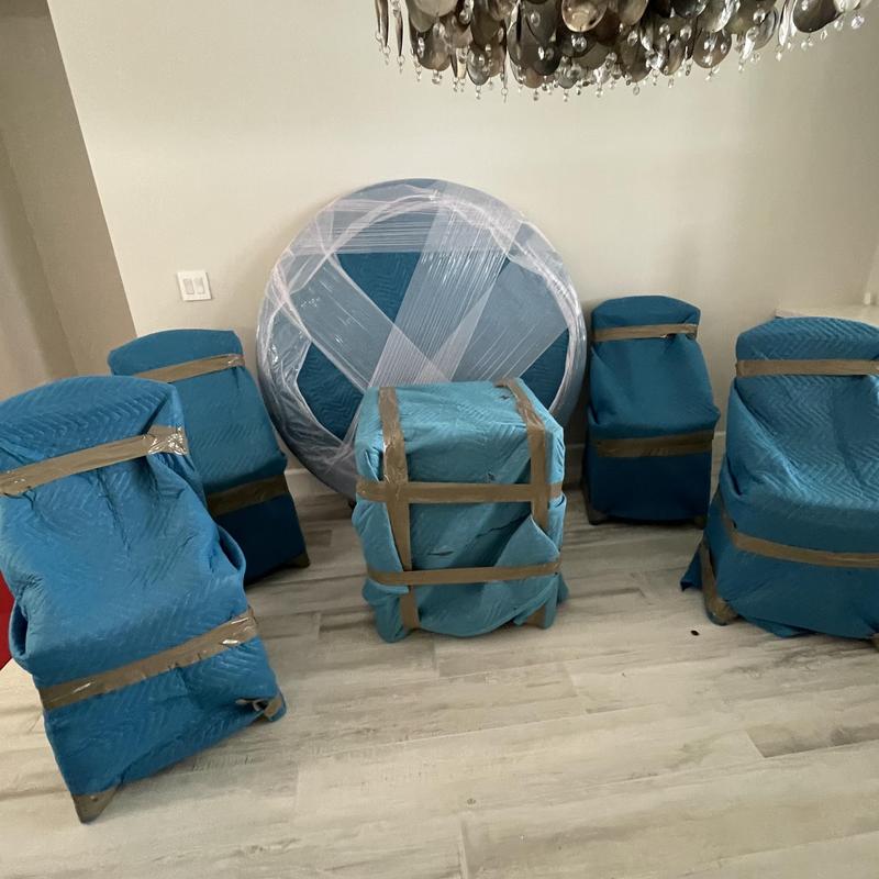 Dining room set wrapped for moving protection