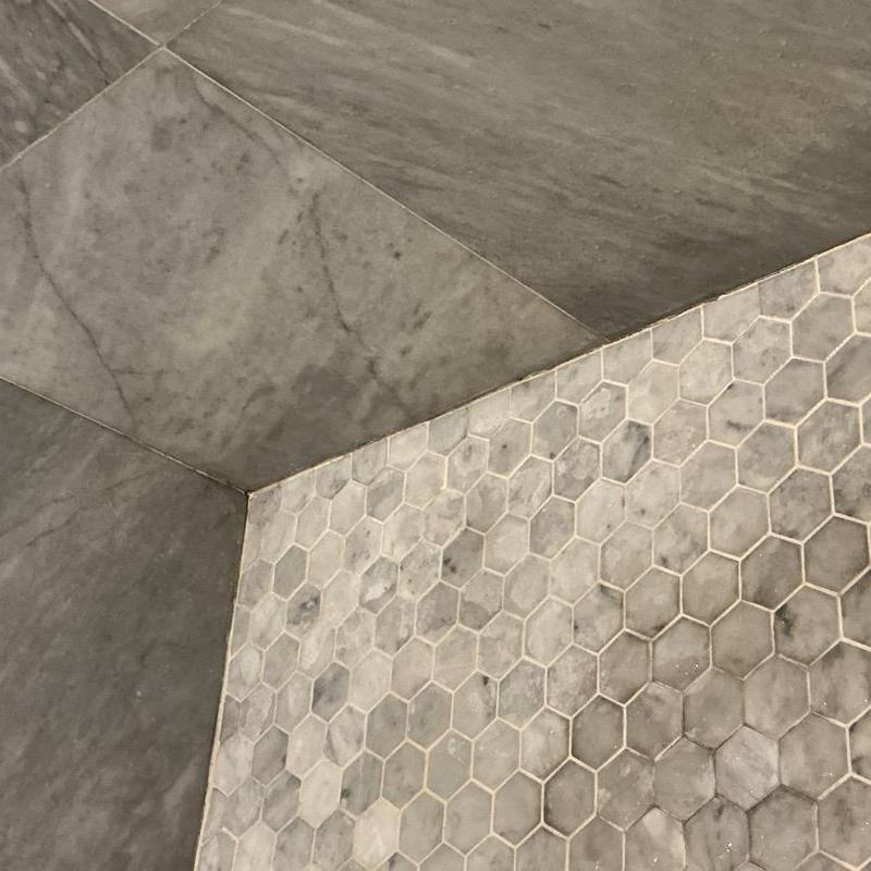 Tile floor with major cracks in corners and grout Tile floor with major cracks in corners and grout