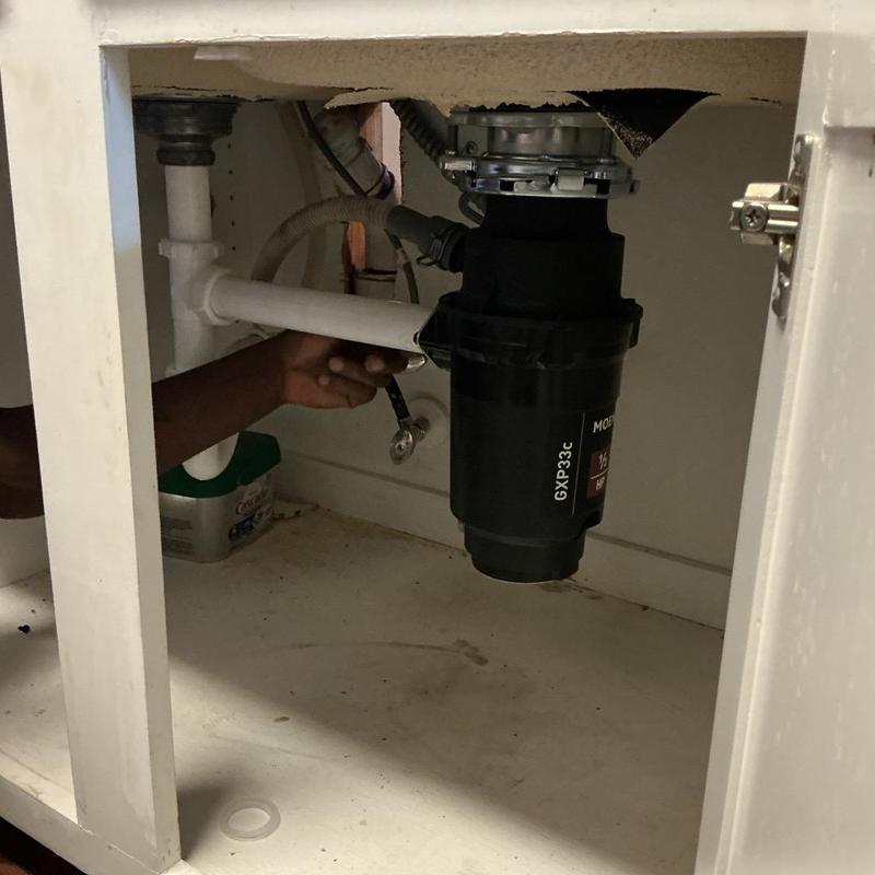 Garbage disposal installation under kitchen sink Garbage disposal installation under kitchen sink