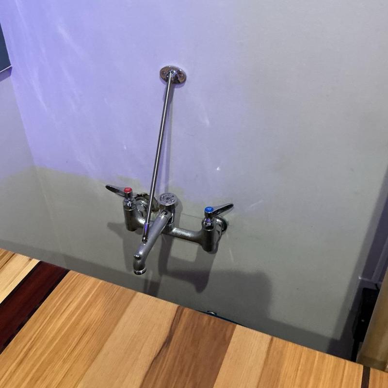 Wall-mounted faucet with cleaned gasket seal, no leaks Wall-mounted faucet with cleaned gasket seal, no leaks