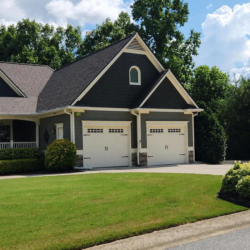 Architectural shingle roof with double garage doors