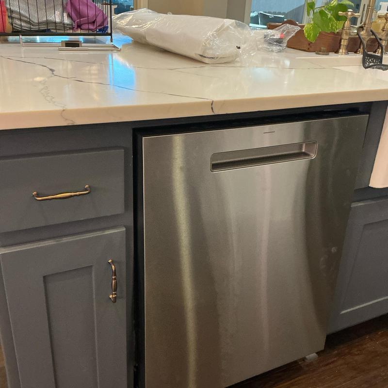 Dishwasher installation in gray kitchen cabinetry