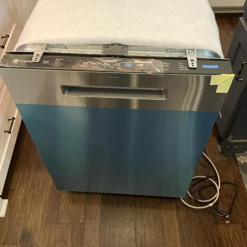 Dishwasher installation with leak check in kitchen