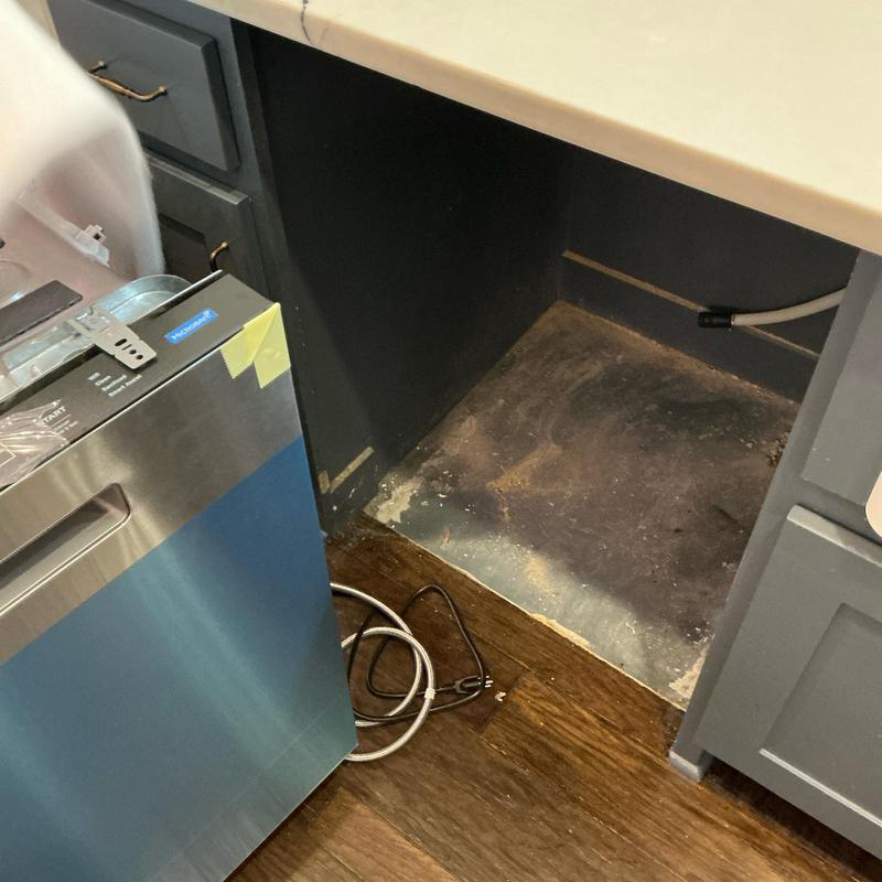 Dishwasher installation space and new unit beside cabinet