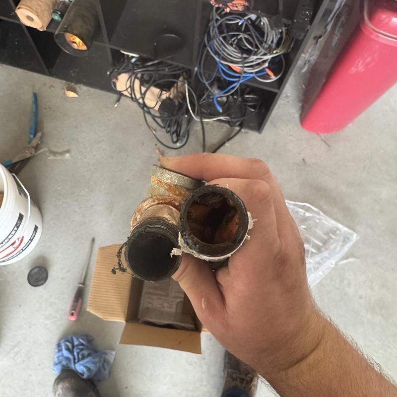Rusty copper plumbing pipes with corrosion buildup Rusty copper plumbing pipes with corrosion buildup