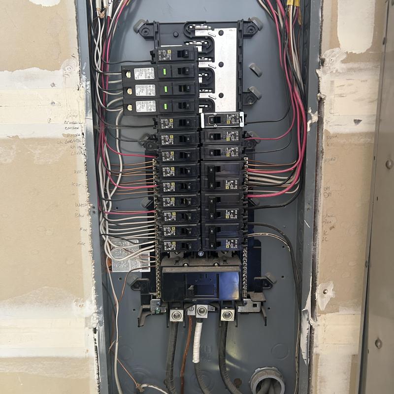 Main electrical panel with circuit breakers and wiring Main electrical panel with circuit breakers and wiring