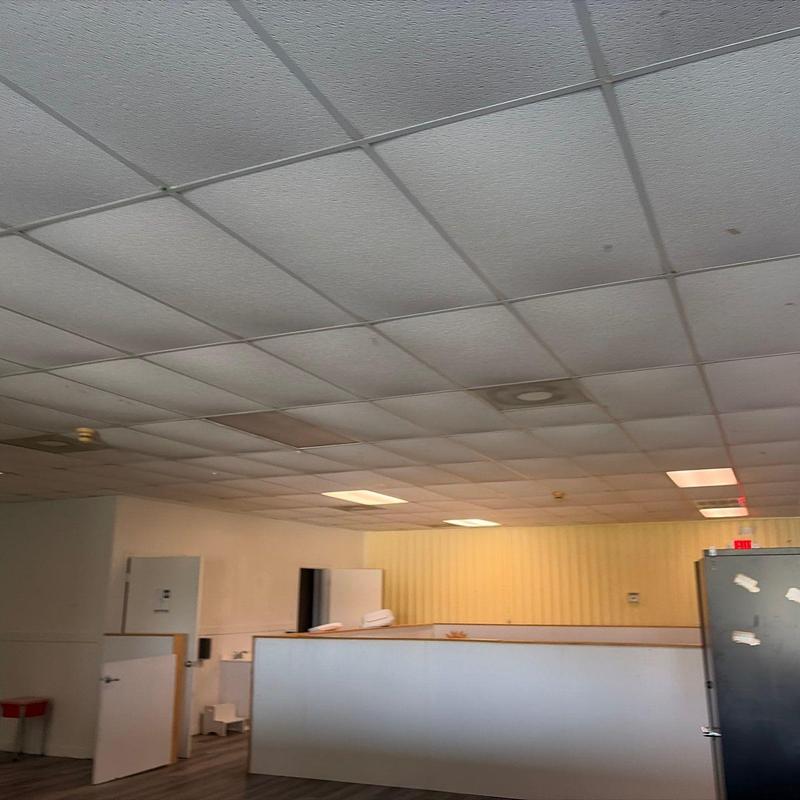 Drop ceiling tiles with noticeable water stains