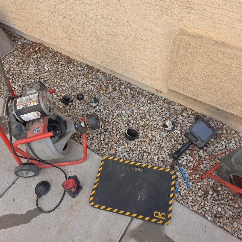 Main sewer line snake and inspection camera setup outdoors