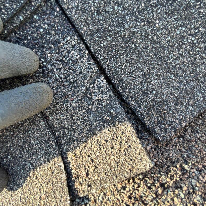 Asphalt shingles with hail damage closeup