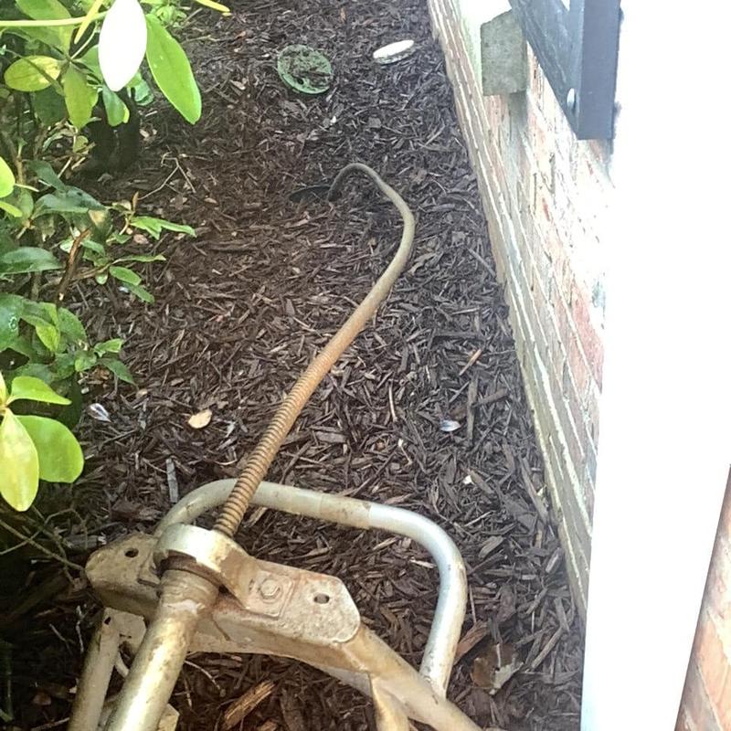 Main sewer line cable auger outside house wall Main sewer line cable auger outside house wall