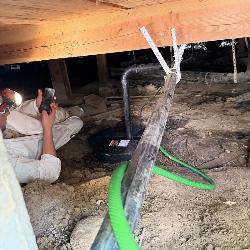 Sump pump installation and plumbing in crawl space