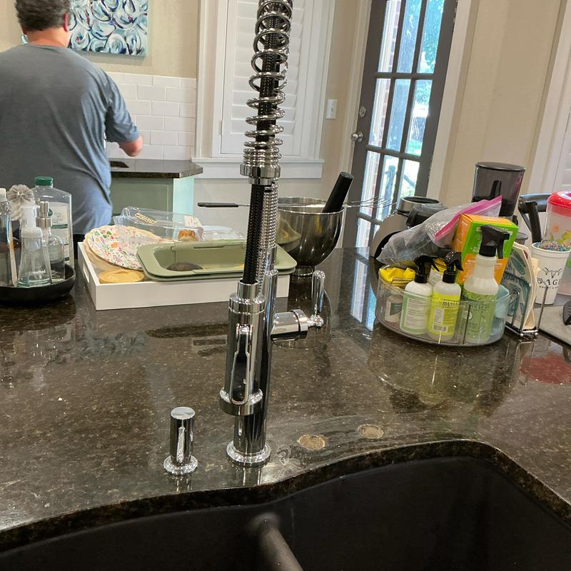 Kitchen faucet installed on granite countertop