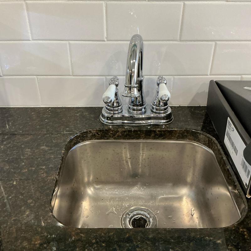 Kitchen faucet installation over stainless sink