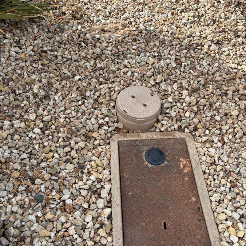Pressure reducing valve with tan access box in gravel Pressure reducing valve with tan access box in gravel