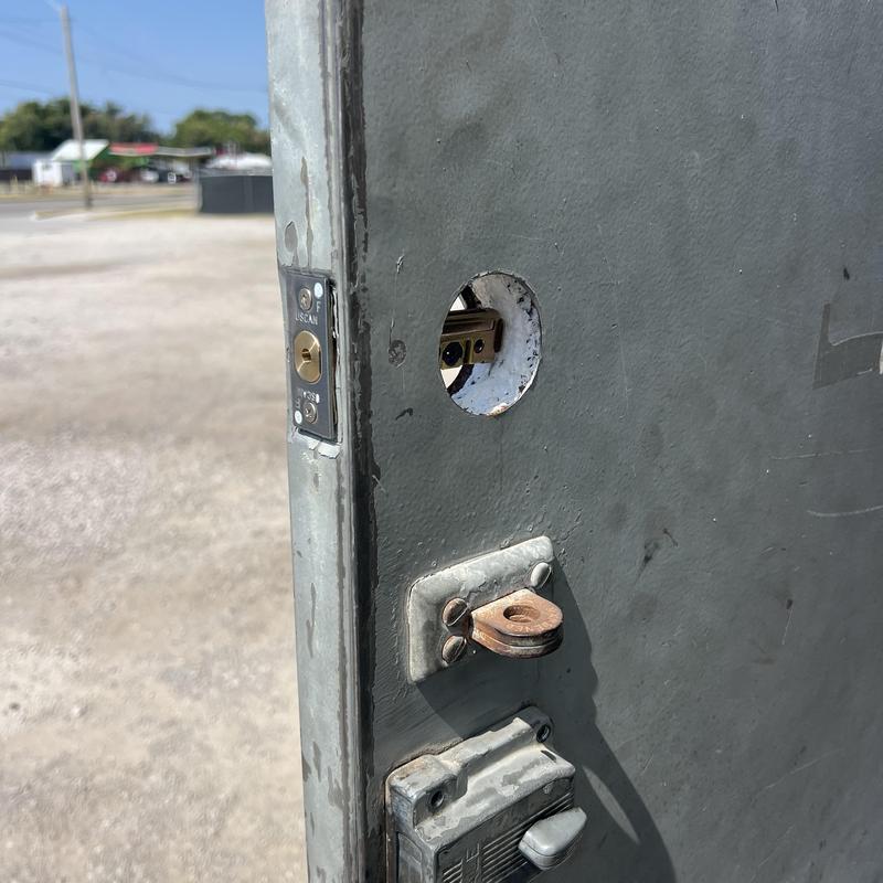 Deadbolt lock mortised hole in metal door jamb Deadbolt lock mortised hole in metal door jamb