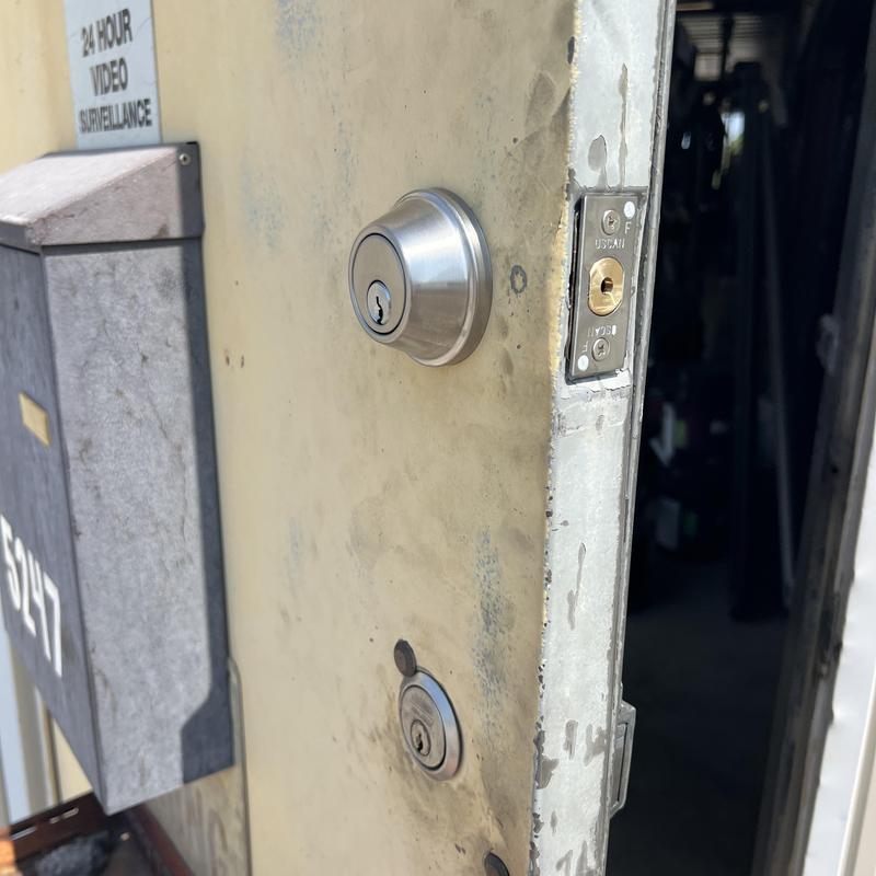 Deadbolt lock mortised into metal door and jamb Deadbolt lock mortised into metal door and jamb