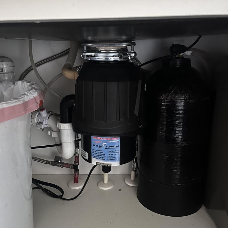 Garbage disposal and water softener under sink installation