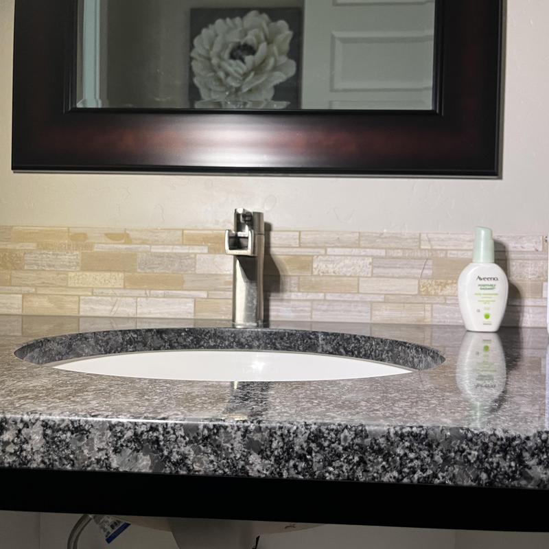 Nickel Pfister faucet installed on granite countertop