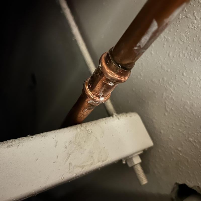 Copper pipe joint in commercial drop ceiling leak repair Copper pipe joint in commercial drop ceiling leak repair
