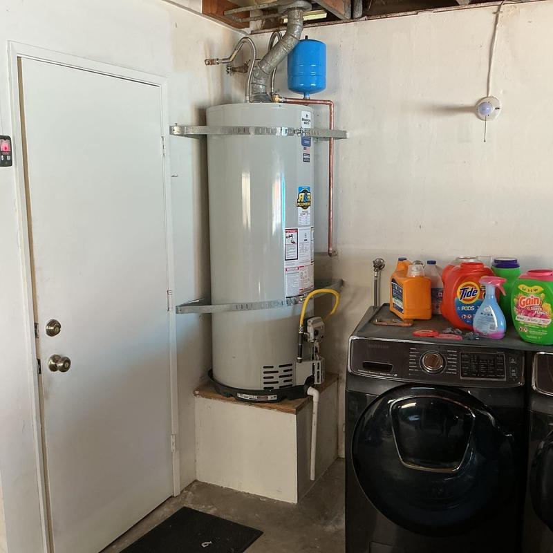 Water heater with expansion tank and laundry appliances