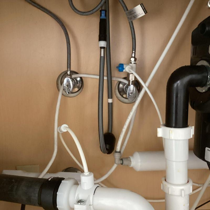 Toilet angle stop and plumbing connections under sink