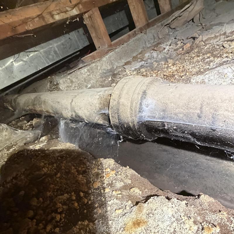 Sewer pipe leak in crawlspace with soil erosion Sewer pipe leak in crawlspace with soil erosion